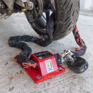 Photo showing MONSTER Closed Shackle padlock with SAS Chain and PJB Double Bridge Anchor securing a motorcycle wheel